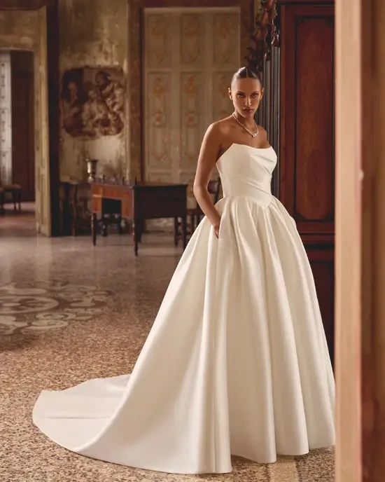 Model wearing white San Patrick dress